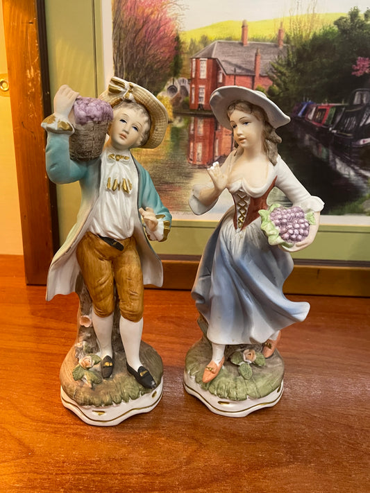 Pair of 2 porcelain “ flower basket “ dolls, England