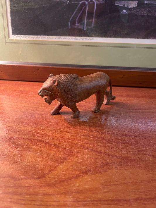 Antique wooden mini lion figurine