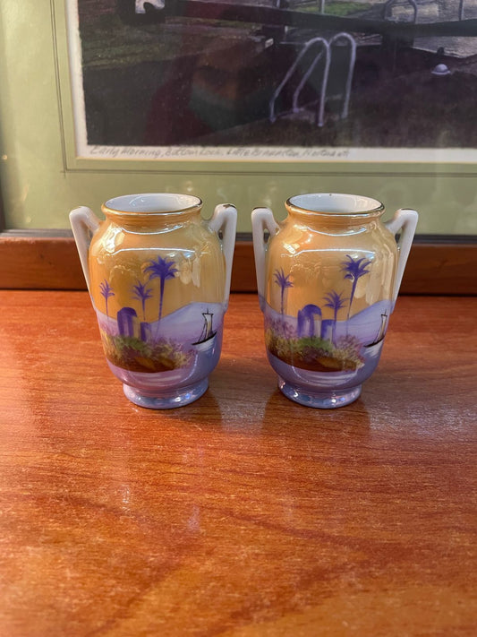 a set of two small hand-painted ceramic vases made by Noritake, Japan.