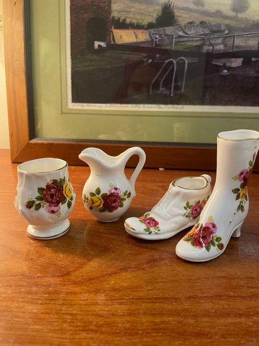 a set of miniature "Cottage Rose" fine bone china collectibles. Old country roses style by Royal Albert.