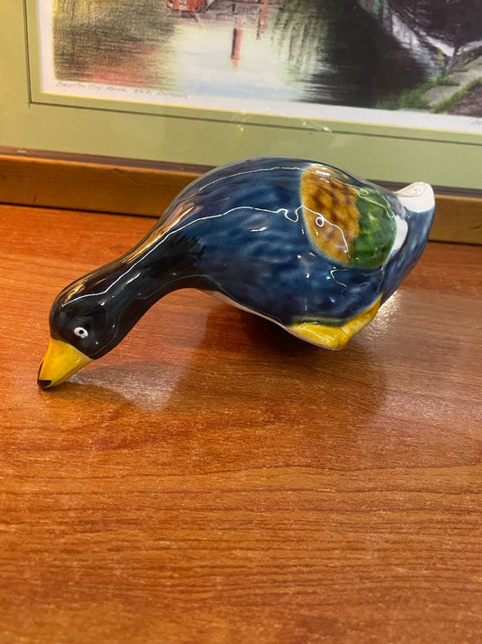 a vintage ceramic duck figurine, possibly by Reducta London.